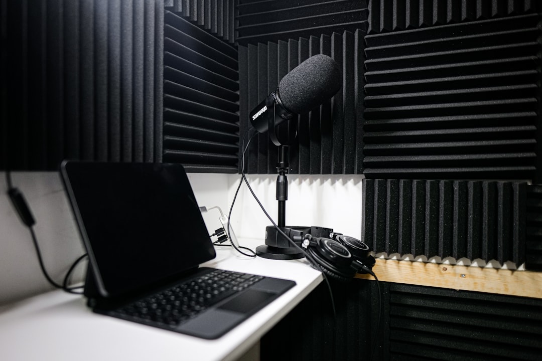 An image depicting the Audio-Technica ATH-M50x in a studio environment, with audio equipment in the 