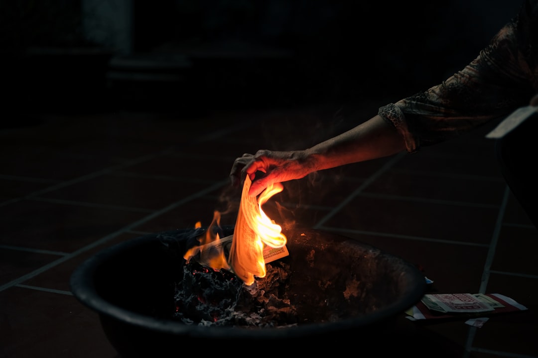 Lifestyle image showing the Soto Pocket Torch being used for cooking or starting a fire, with a beau
