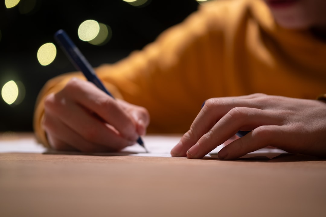 Image of a hand comfortably holding a Pentel mechanical pencil, demonstrating the grip and ease of u