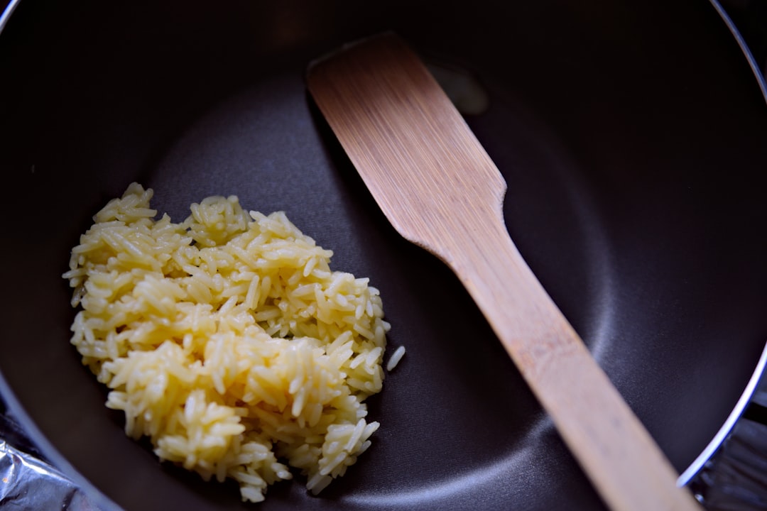 A close-up image of the Zojirushi Neuro Fuzzy Rice Cooker in action, with rice being cooked inside. 