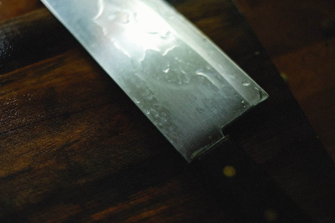Close-up images of the blades and handles of different Yoshihiro knives, showing the high-carbon ste
