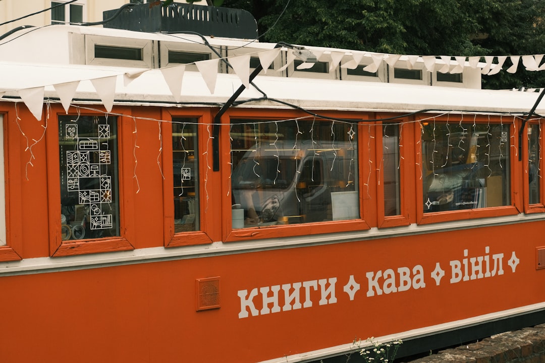 An image of the Audio-Technica AT-LP60X turntable in a cozy setting, with a vinyl record playing and