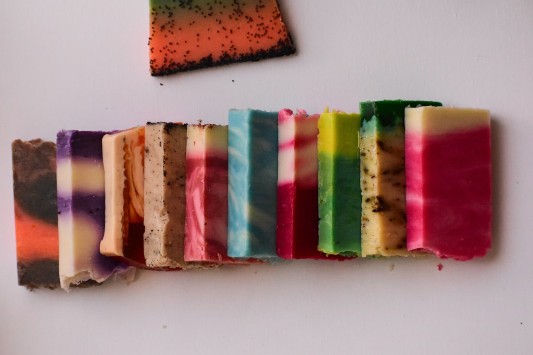 A vibrant flat lay image featuring a variety of colorful washi tapes arranged artistically on a whit