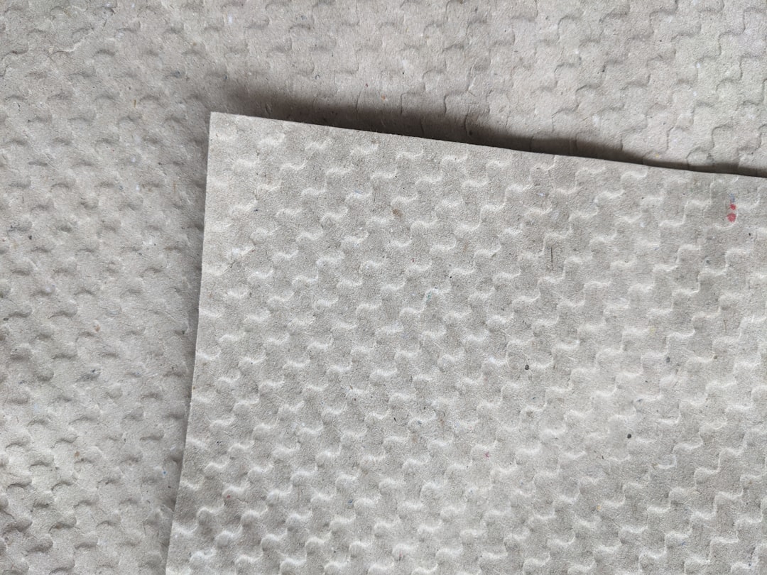 A close-up image of different tarp materials (polyethylene, nylon, canvas) laid out side by side to 