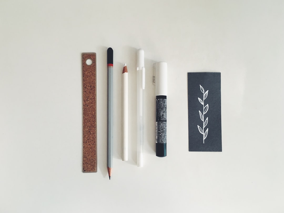 An image showcasing the Kinto Pencil Case with pens neatly organized inside, emphasizing its minimal