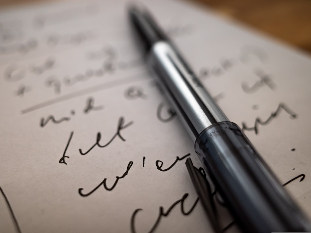 An image showcasing a close-up of a Uni-ball Signo Gel Pen writing on high-quality paper, emphasizin