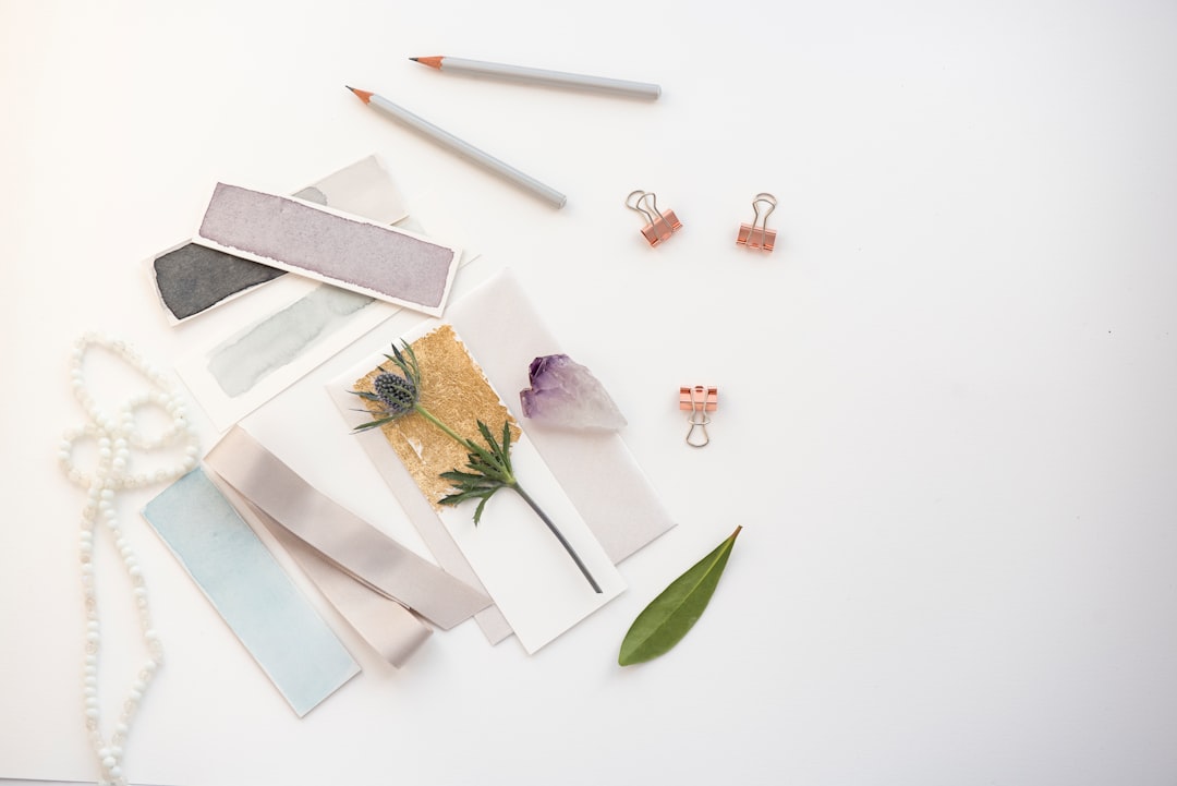A beautifully arranged flat lay of various Uni products including Uni-ball Signo Gel Pens and Uni Me