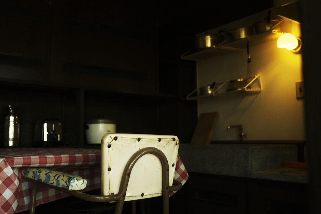 A beautifully styled kitchen countertop featuring multiple Zojirushi rice cookers, with a bowl of pe