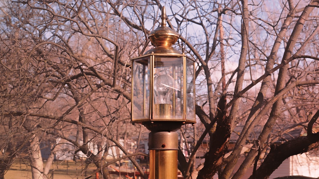 A side-by-side comparison image featuring the Montbell Mini Lantern and the Montbell Power Lantern i