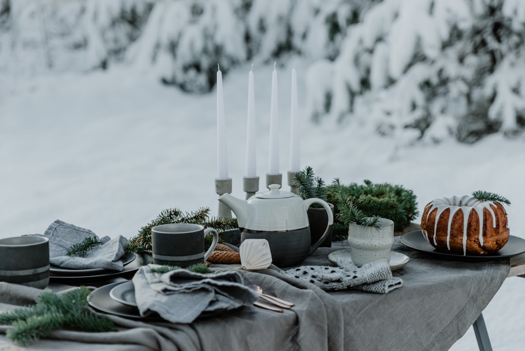An image of the Snow Peak Teflon Coated Cookware Set displayed outdoors, with emphasis on its lightw