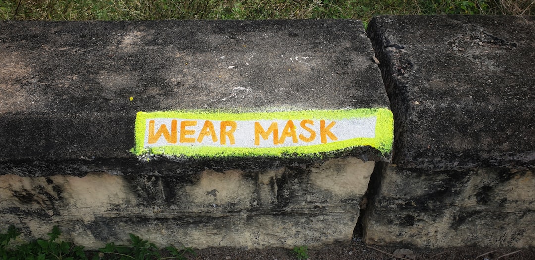 A dynamic image of Kamoi Masking Tape being applied to a tent or outdoor gear, showcasing its water-