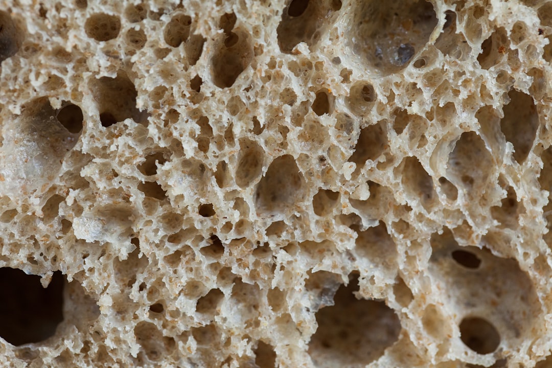 Close-up of Pitera ingredient, illustrating the fermentation process with yeast cells and the produc