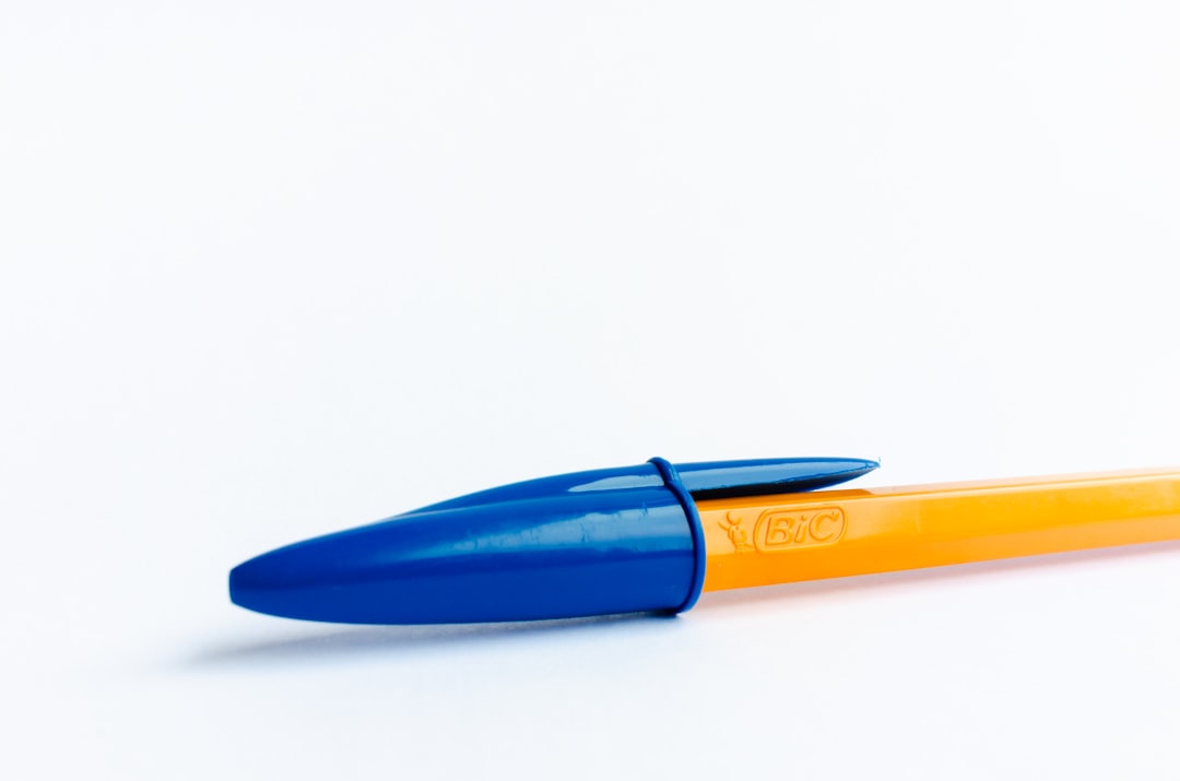 An image of the Pentel EnerGel pen, featuring a vibrant ink flow on a notepad, depicting its smooth 