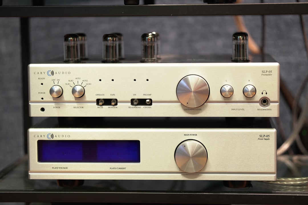 An artistic shot of the AT-BHA100 headphone amplifier with headphones plugged in, highlighting its d