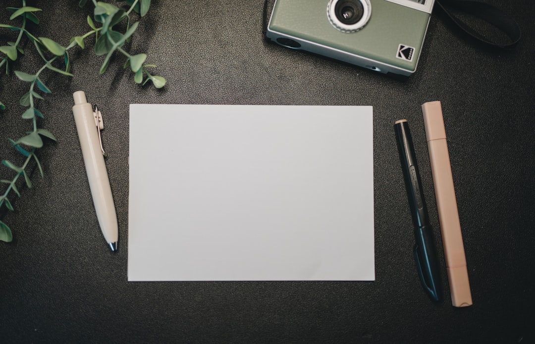 Image of the Hoya HD UV Filter next to the Olympus OM-D camera, showcasing its protective qualities.