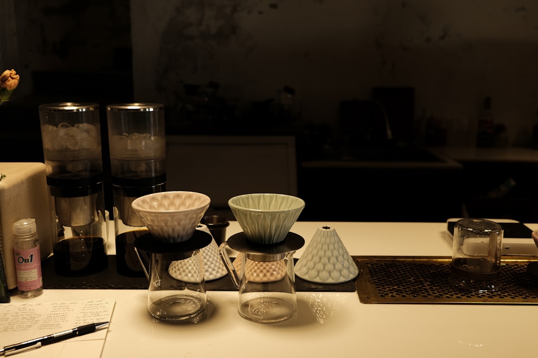 A visually appealing image featuring both a ceramic and glass baking dish side by side on a rustic w