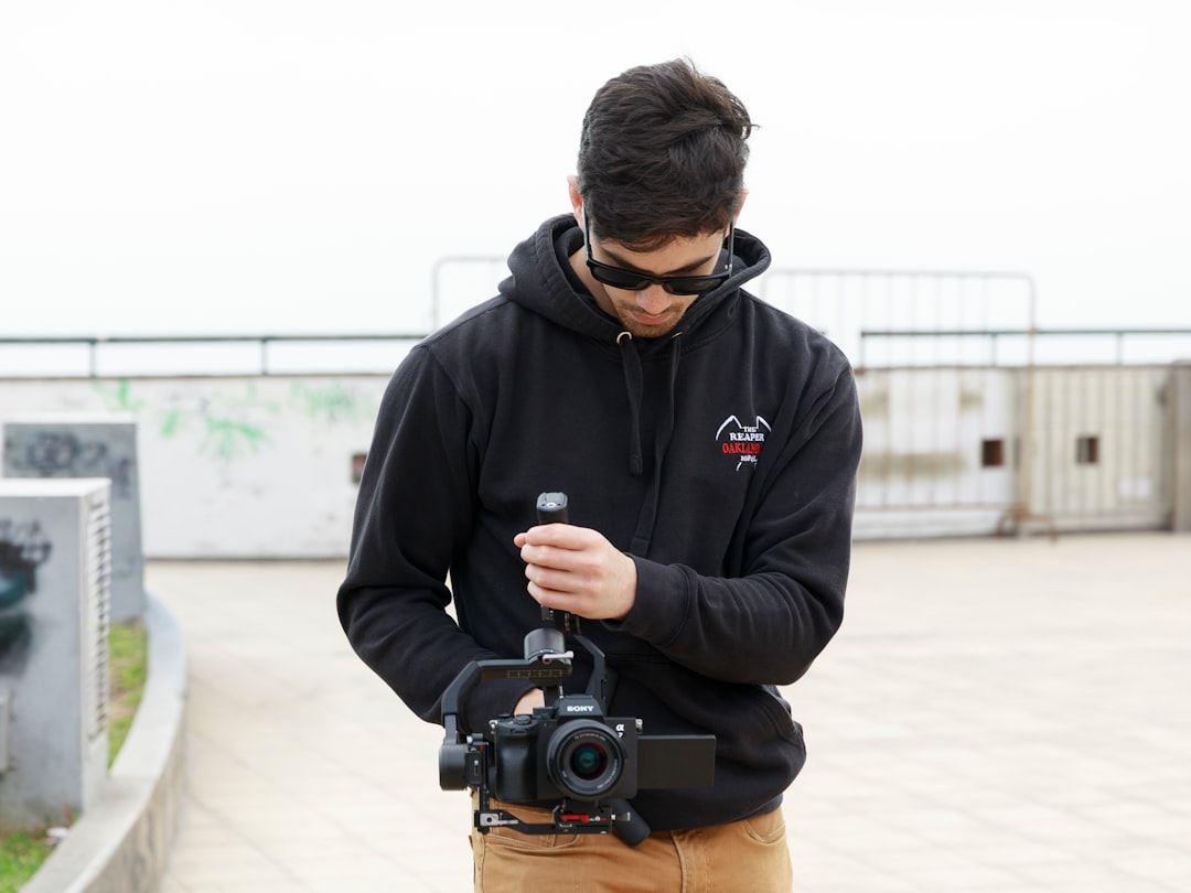 Image of a traveler using the Sony ZV-1 camera to film a vlog in a vibrant outdoor setting. This cou