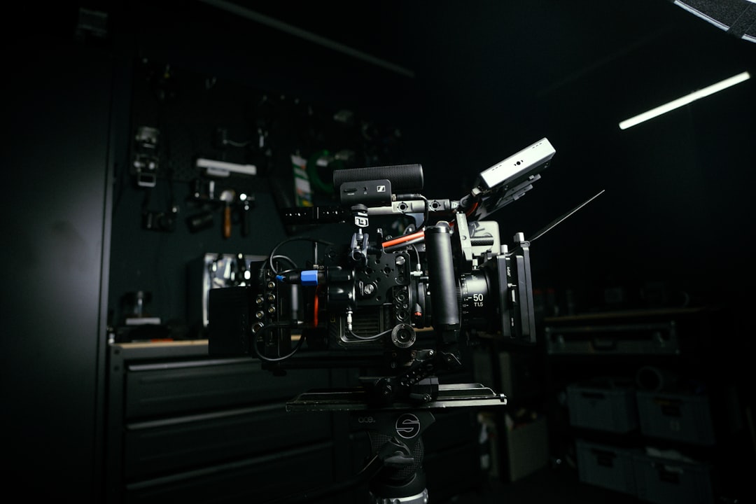 An image of the Sennheiser HD 650 headphones with an open-back design, displayed on a wooden table w