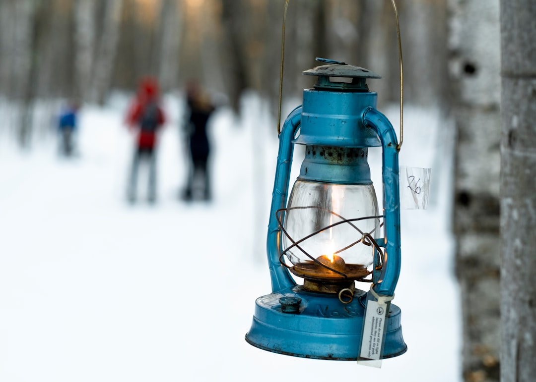 Close-up shot of the Snow Peak Mini Hozuki lantern, highlighting its minimalist design and adjustabl