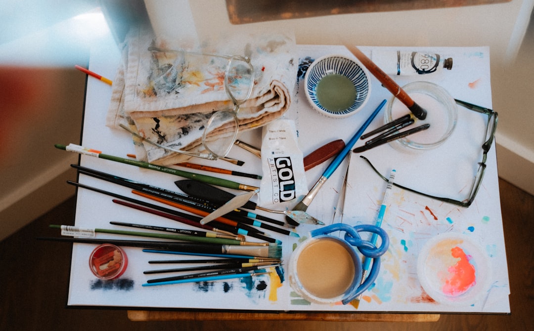 A visually striking image showing a variety of brush pens and traditional markers spread out on a co