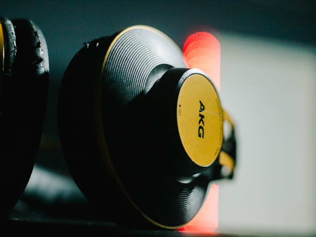 A visually striking image featuring both Sony and Audio-Technica headphones side by side on a sleek