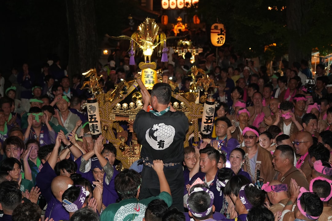 A portable Japanese lantern being packed into a backpack, emphasizing the ease of transportation for