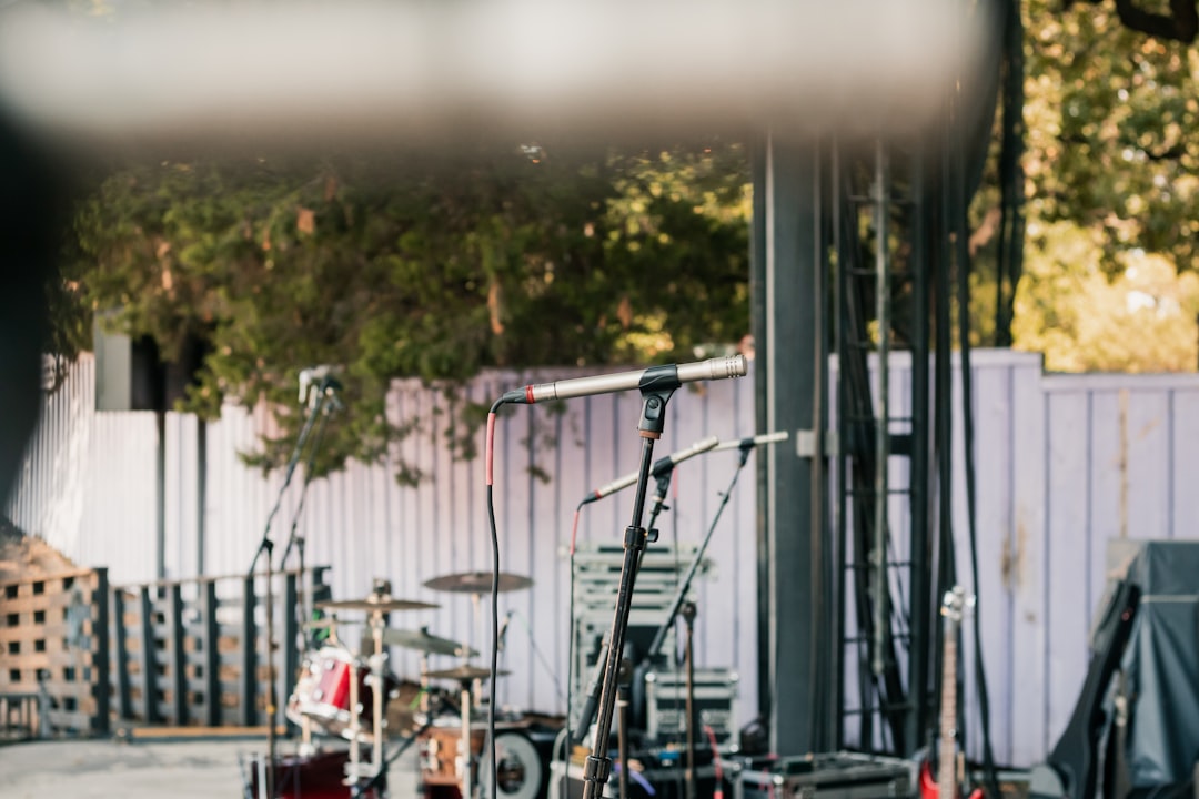 A striking image featuring both microphones (Audio-Technica AT2020 and Shure SM57) side by side on a