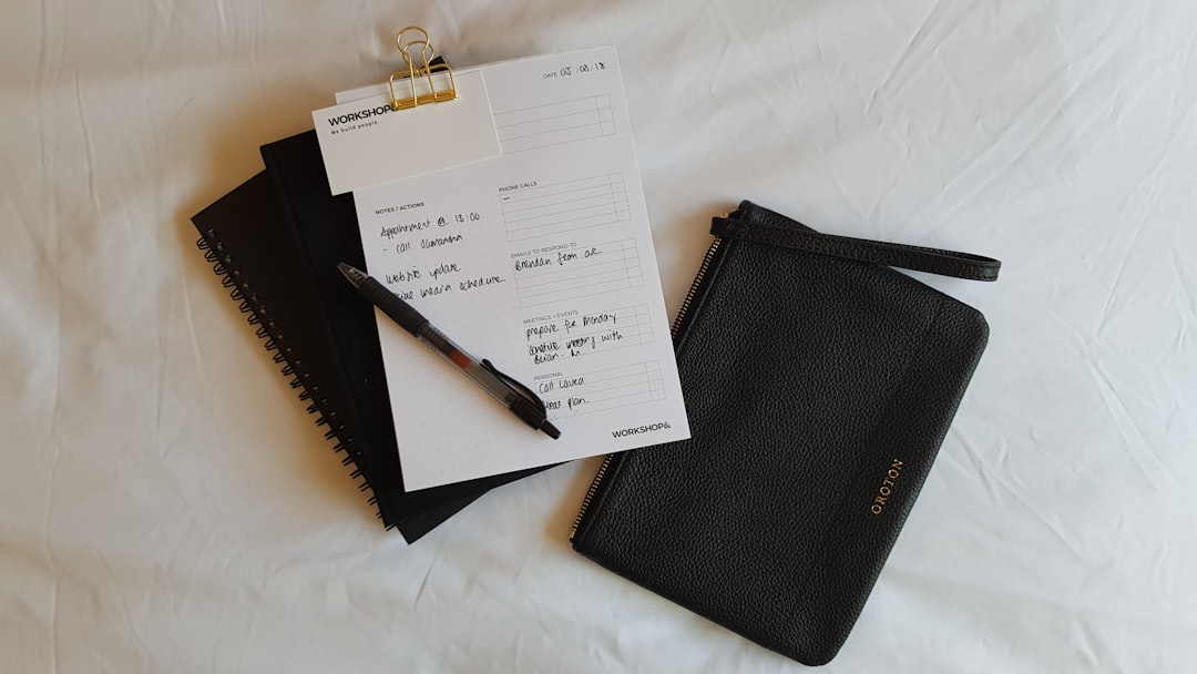 Image of the Pilot Notetaker Notebook with a pen and notes scattered around, demonstrating its every