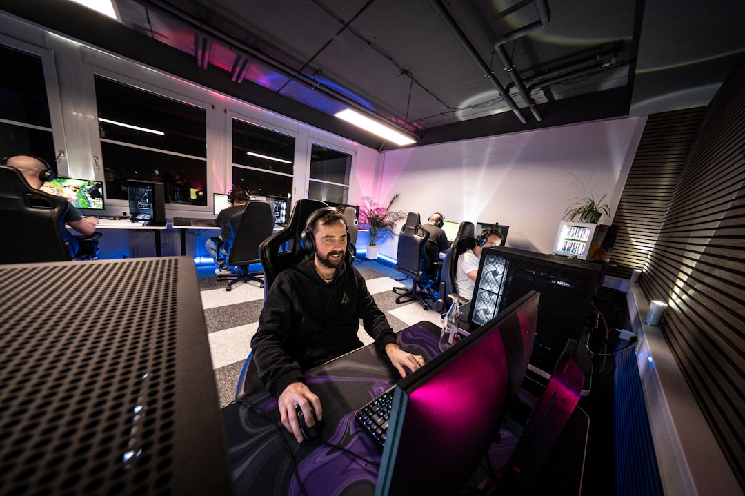 An image of the Sony WH-1000XM4 headphones laid on a backpack next to a campfire setup, showcasing t