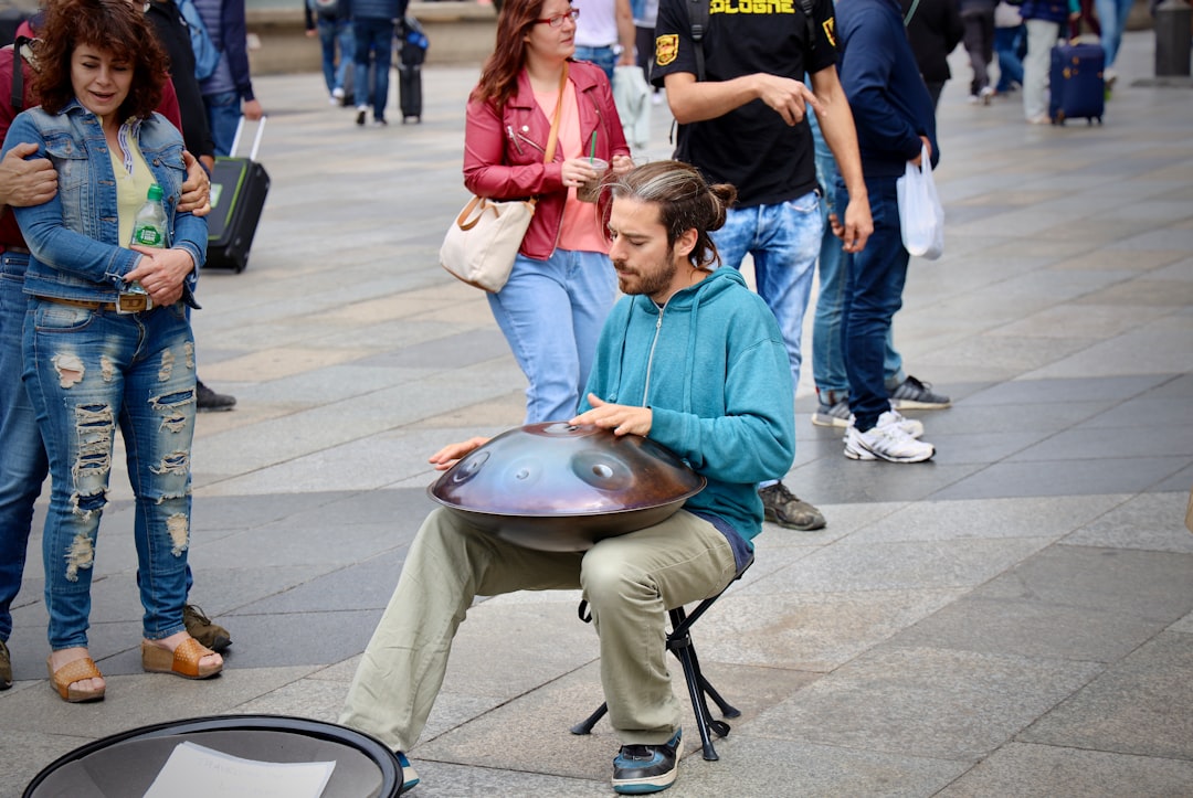 A lifestyle image of a person enjoying music using the Marantz CD6007 CD Player, emphasizing user ex