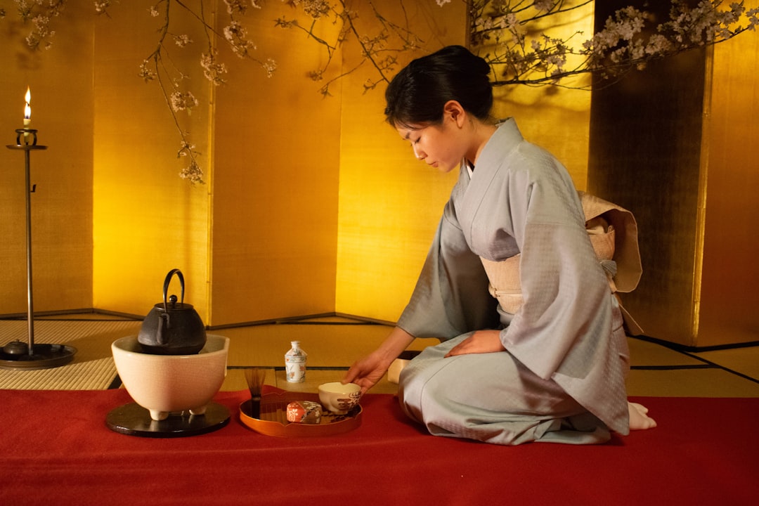 A beautifully arranged scene featuring several Japanese tea kettles, including a cast iron kettle an