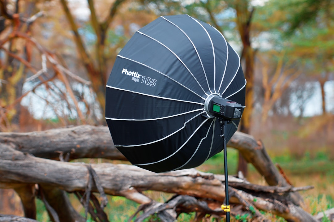 A vibrant outdoor scene featuring various portable devices (smartwatch, headphones, portable charger