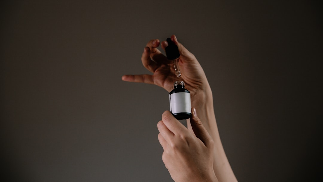 A beautiful outdoor scene featuring Kose's Sekkisei skincare products arranged on a wooden surface w