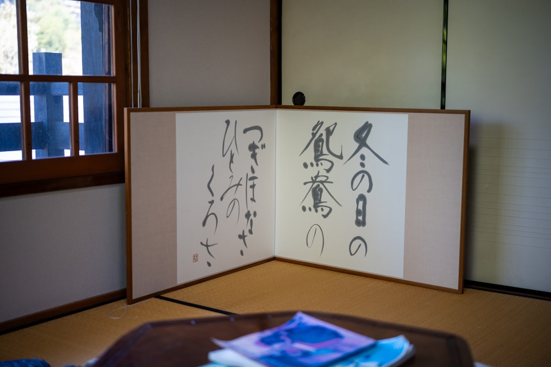 Image of the Seibu Kogyo Sketchbook on an artist's desk with charcoal and pencils, showing its thick