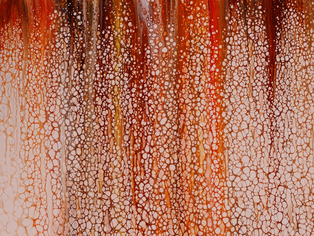 An image showing the texture of SK-II Facial Treatment Essence being poured from the bottle, highlig