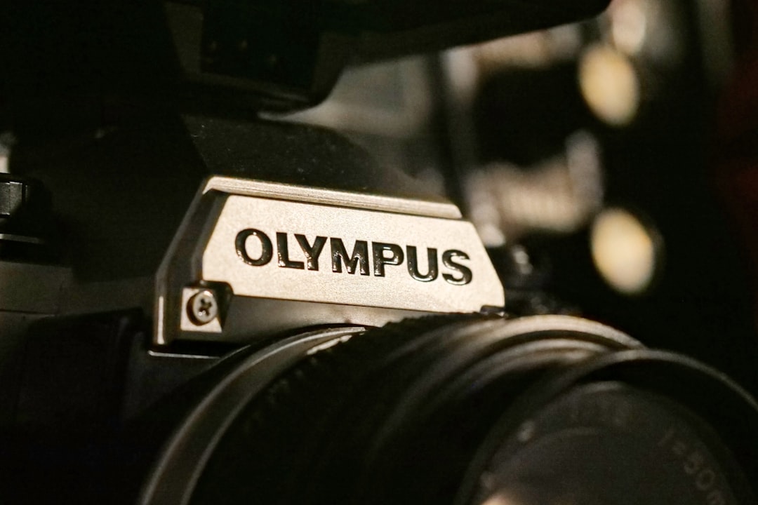 A close-up shot of the Olympus OM-D E-M10 Mark III, showcasing its stylish design and compact size, 