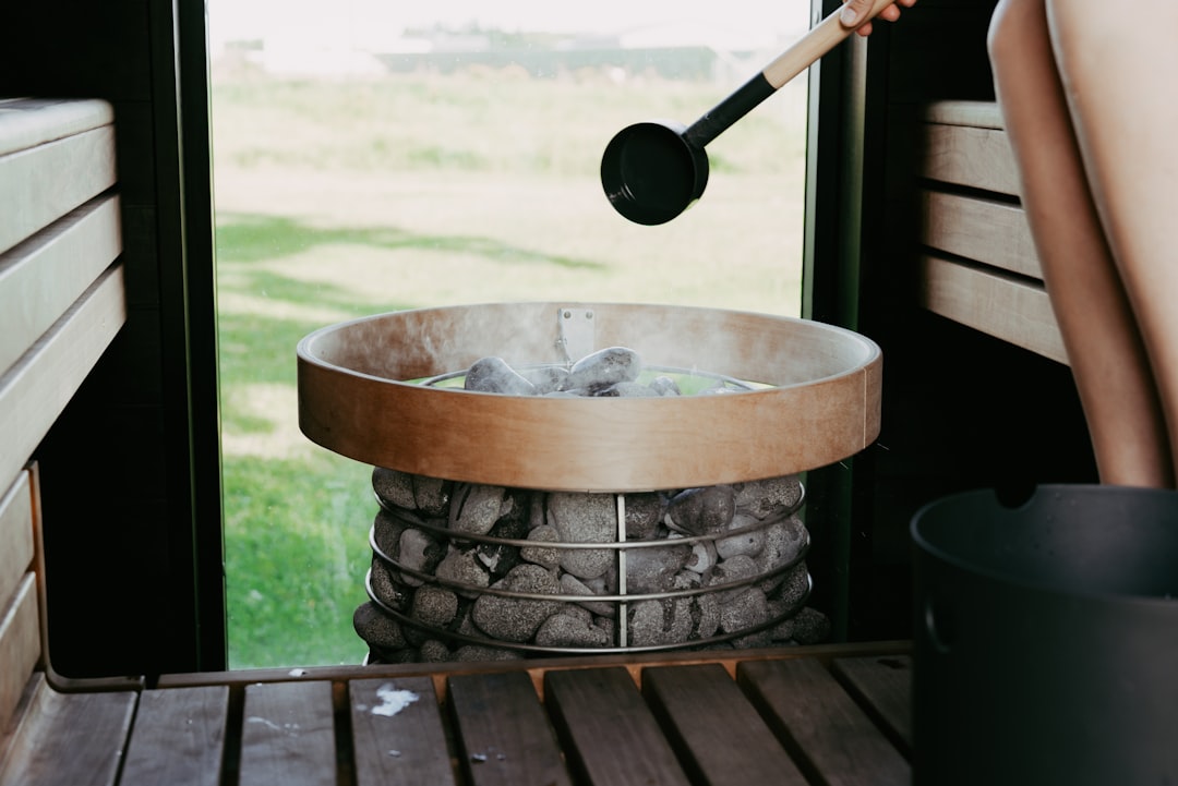 Hero image showing a Zojirushi rice cooker on a rustic wooden table with freshly cooked steaming ric