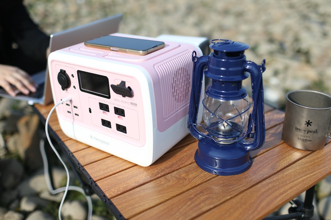 Image of the Hario Mini Mill Slim Plus manual coffee grinder in use outdoors. Show a person grinding