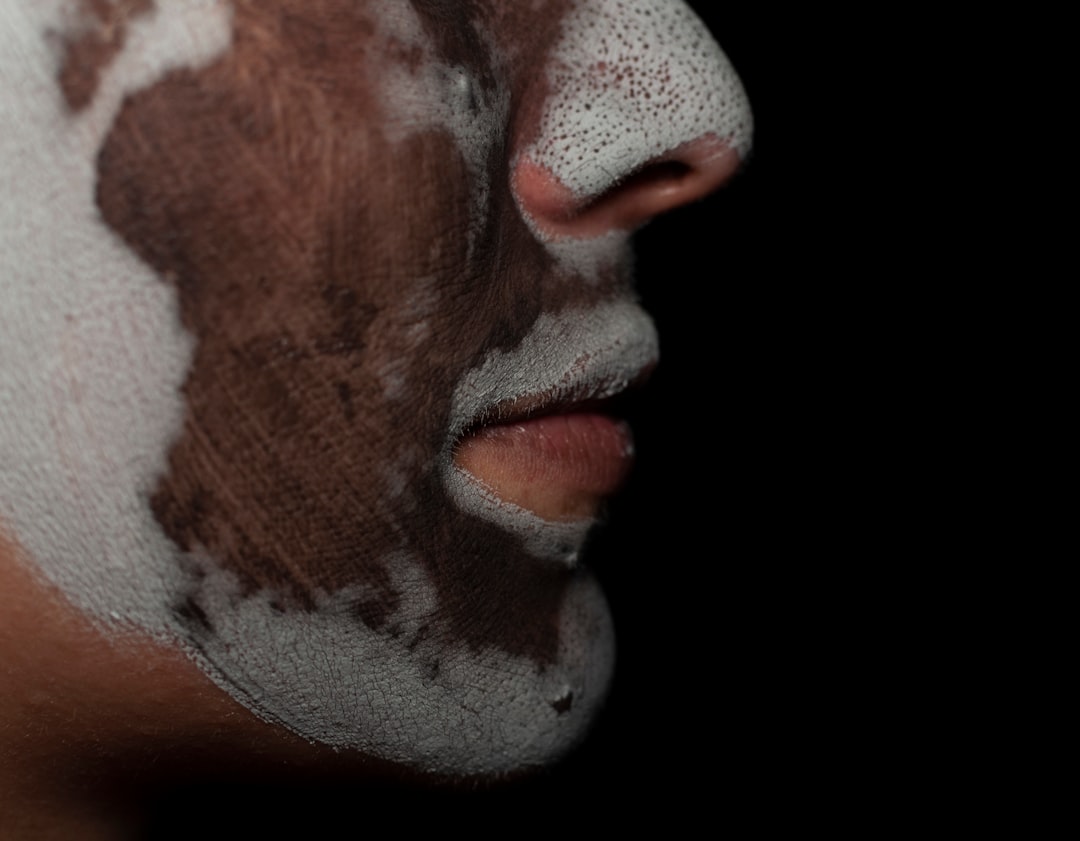 Close-up image of the Kanebo Suisai Beauty Clear Powder capsules with powder and water droplets, sho