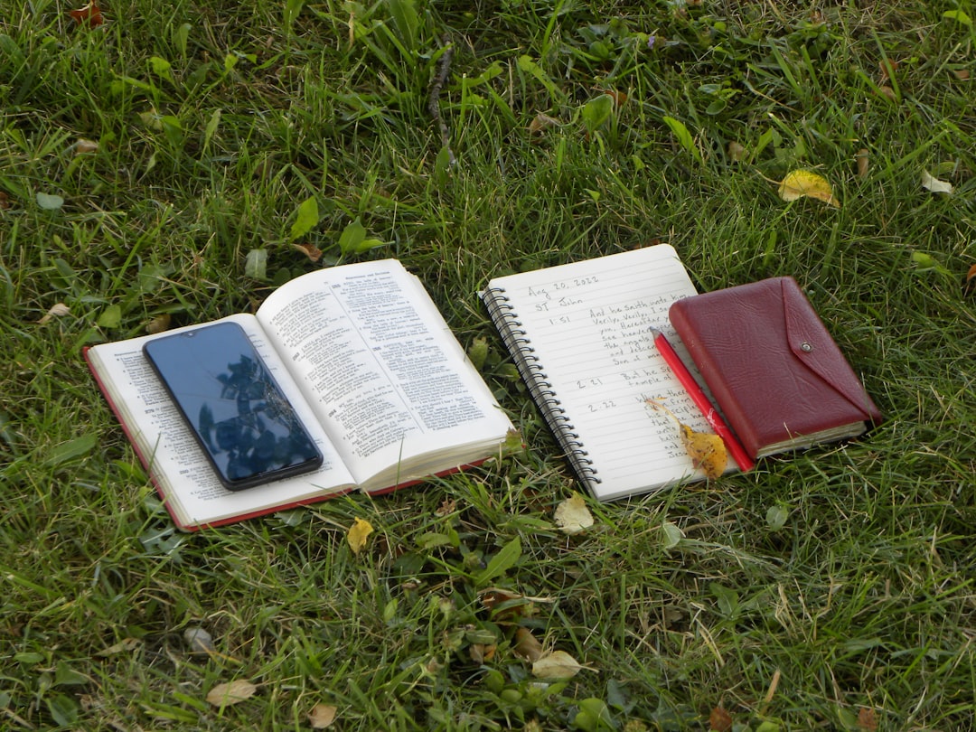 Lifestyle image showing a person outdoors (e.g., camping or hiking) using a water-resistant pen case