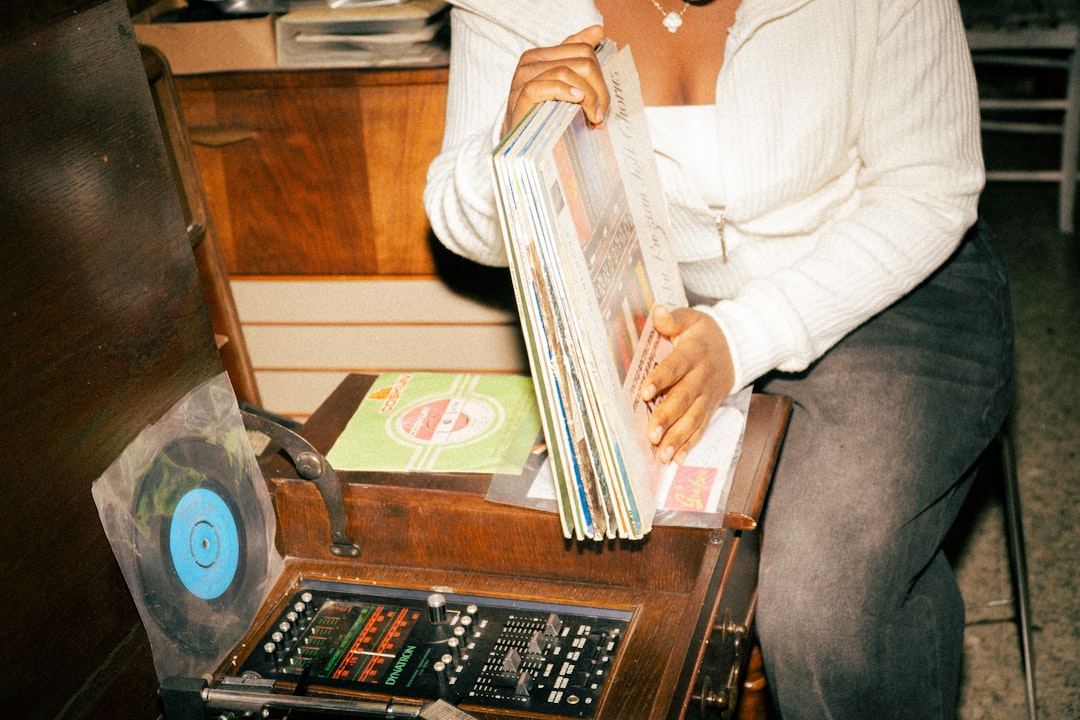 Historical black-and-white or vintage-style photo of early Audio-Technica phono cartridges or an ear