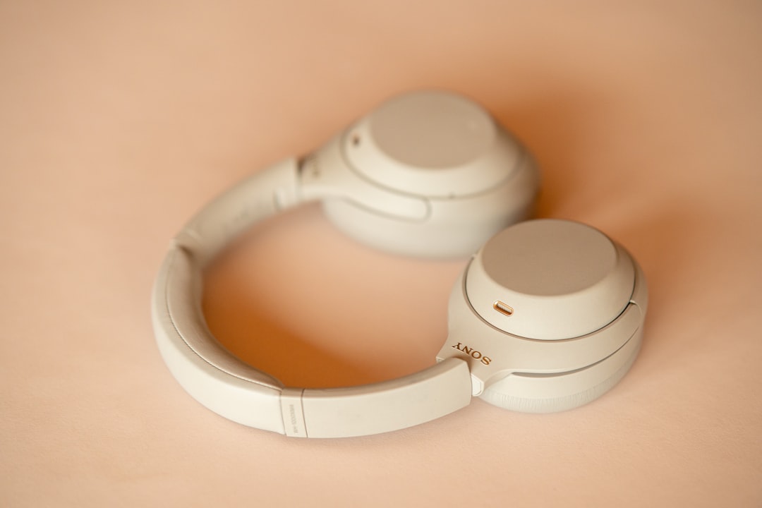 Vintage style shot of the Panasonic RP-HTX80 Retro Wireless Headphones on a wooden table with a blur