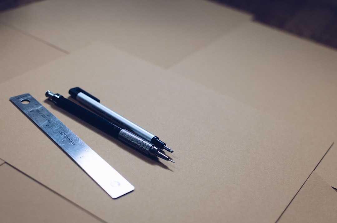 Photo showcasing the Pentel Hi-Polymer Eraser alongside a sketchbook and graphite pencils, emphasizi