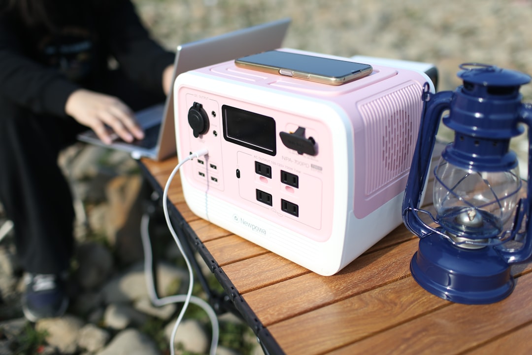 Lifestyle image of the Panasonic SC-PMX100 Portable Bluetooth Speaker in use at a picnic or campsite