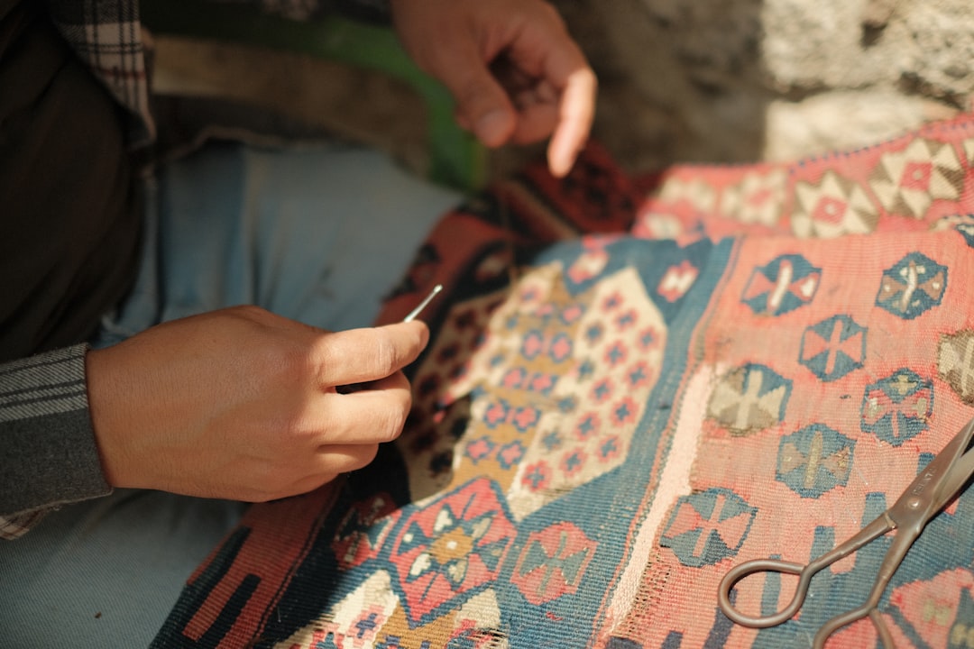 Close-up image of a Nanga sleeping bag being crafted or inspected in a Japanese workshop, highlighti