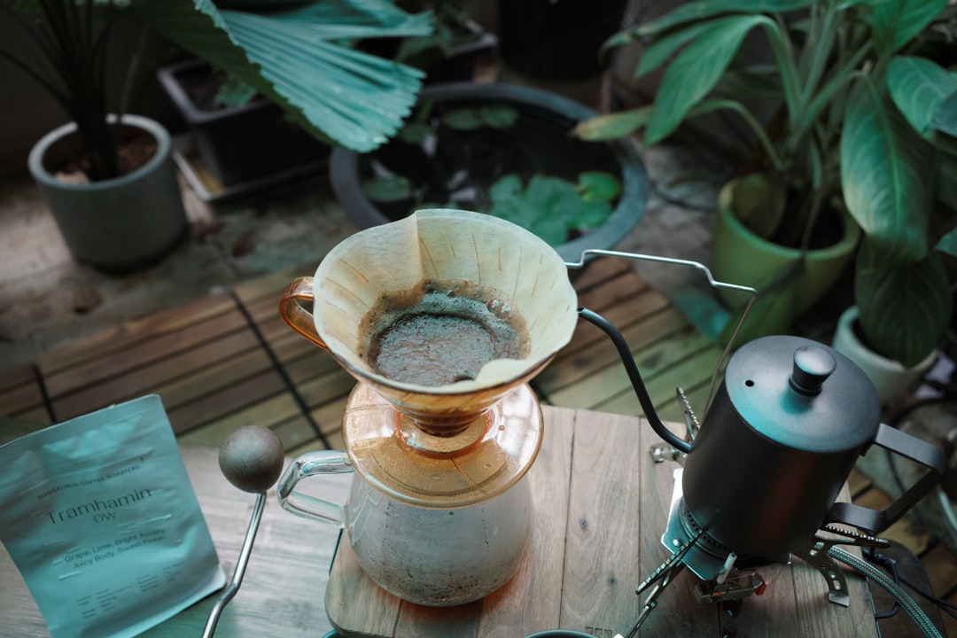 Step-by-step photo series or single image showing the slow, precise pouring technique with the Hario