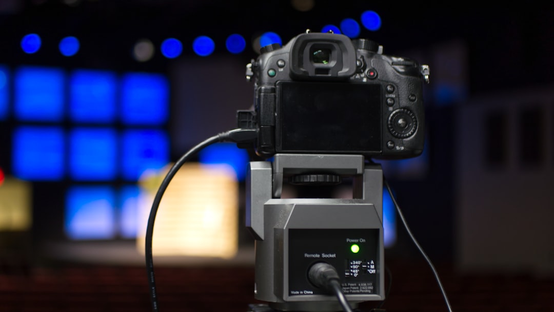 Image of the Panasonic Lumix GH5 II camera with external microphone attached, highlighting its advan