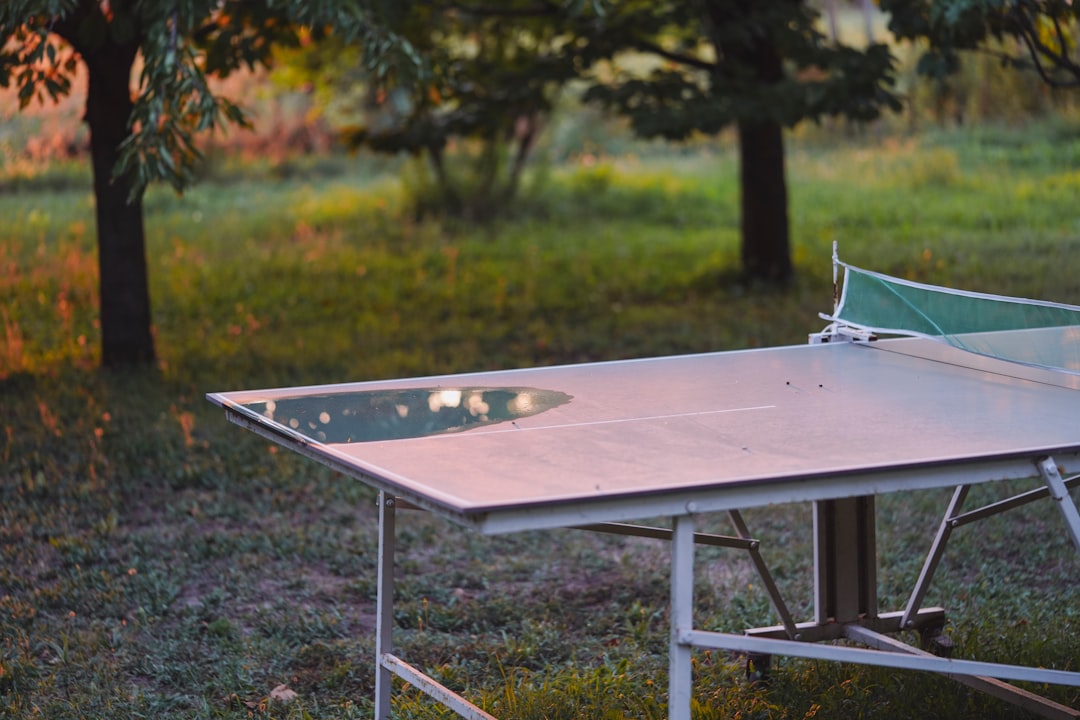 A beautifully composed outdoor scene featuring Snow Peak’s Pack & Carry Table set up at a serene cam