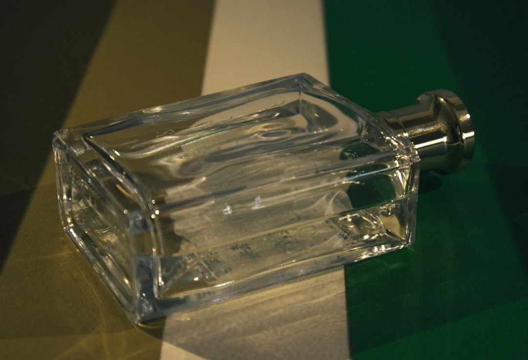 Image of SK-II Facial Treatment Essence bottle with a dropper or pouring essence into palm, emphasiz