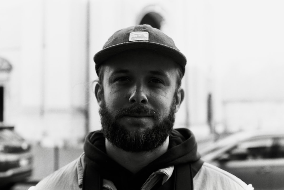 A dynamic hero image featuring an outdoor traveler (e.g., hiker or urban explorer) holding a Panason